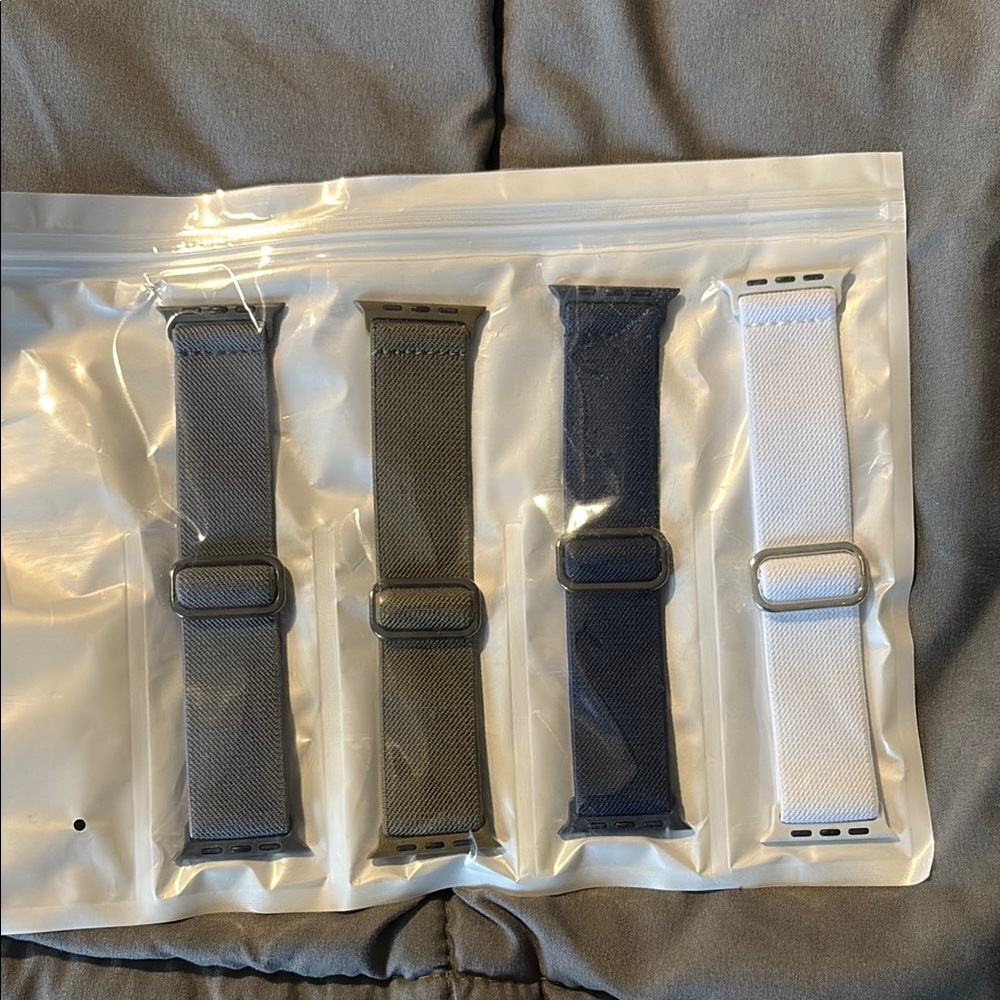 Set of Four Apple Watch Bands in Gray, Green, Black, and White